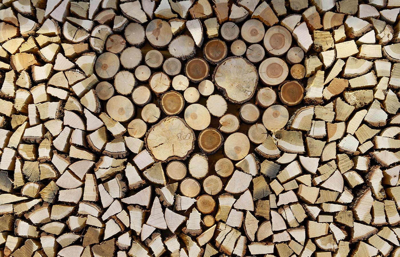 Details of a heart drawn on wooden logs